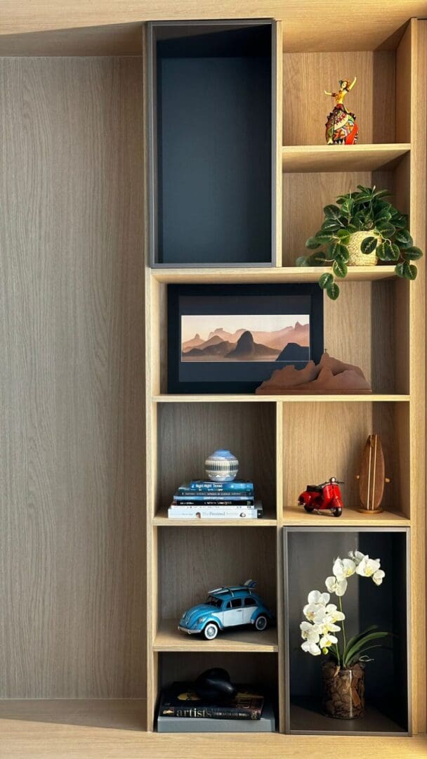 A bookshelf with some books and decoration